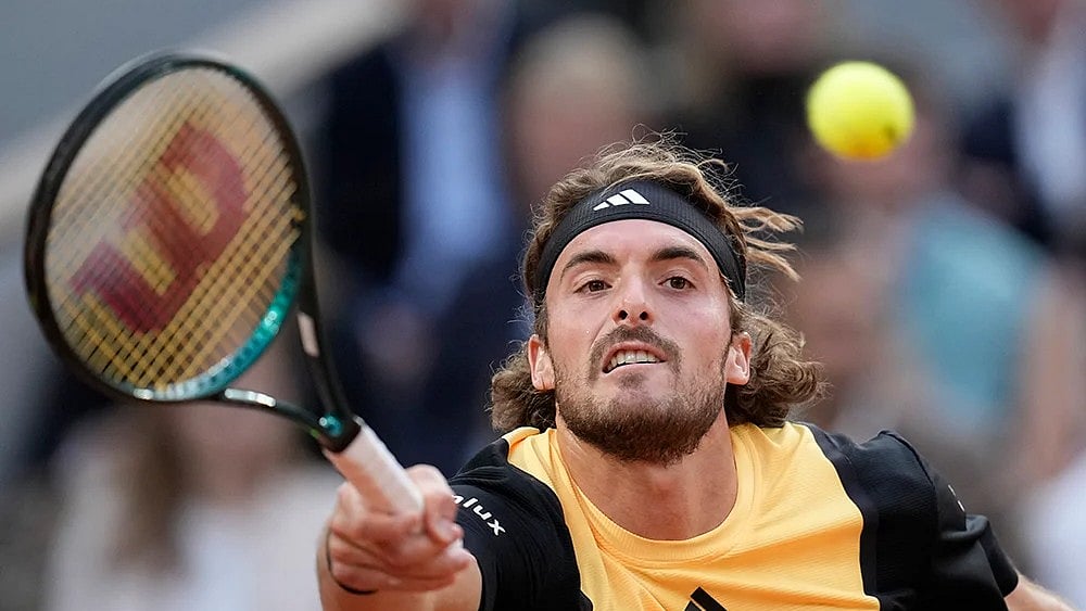 | Photo: AP/Christophe Ena : Stefanos Tsitsipas takes on Alexandre Muller.